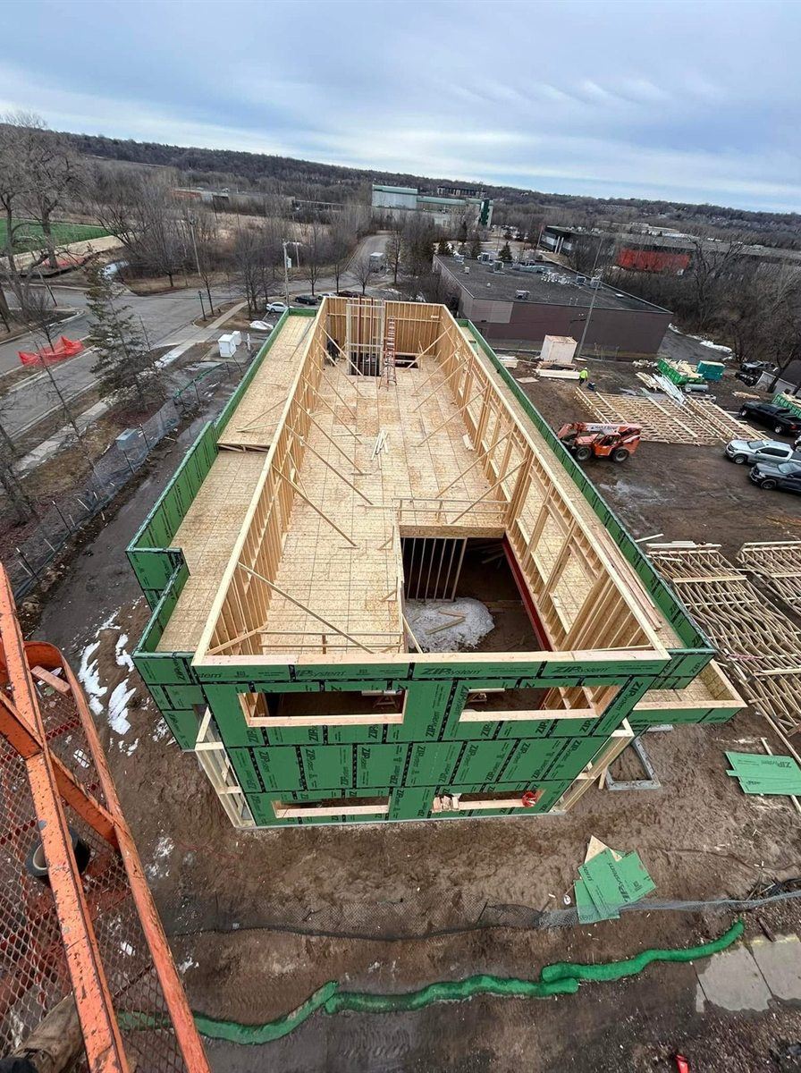 Second floor framing from a lift, by New West Co