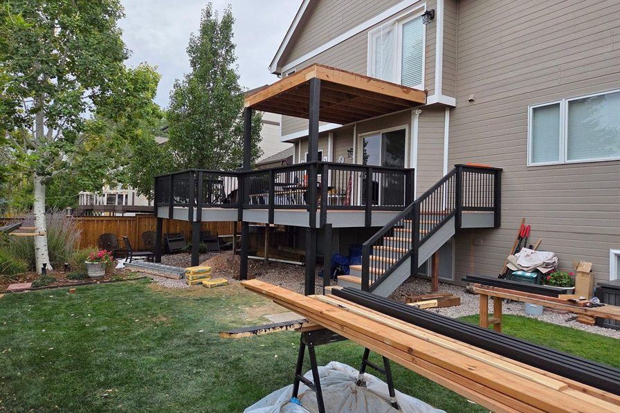 Cedar upper deck with covered roof, by New West Co