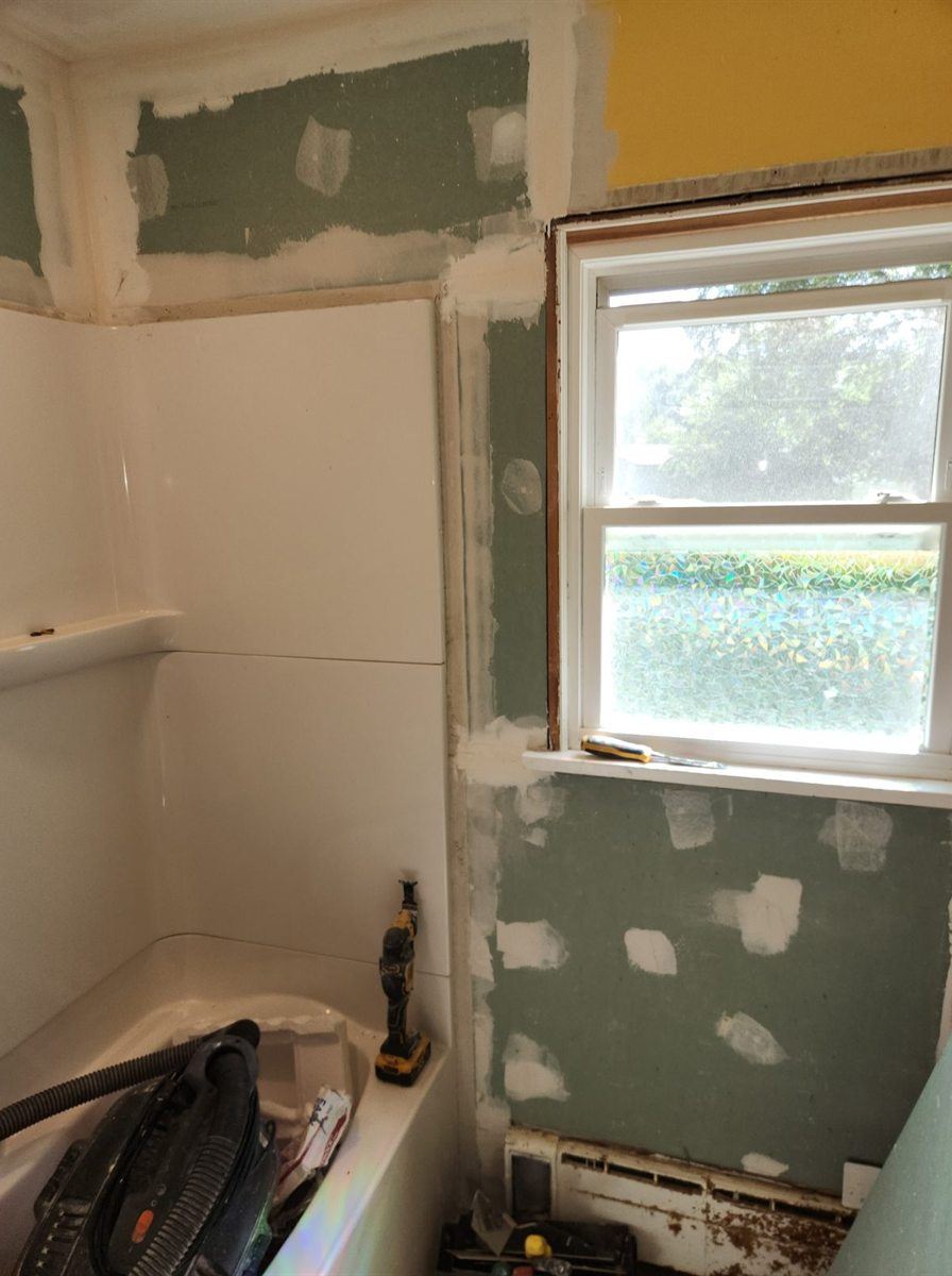 Bathroom during demolition, by New West Co