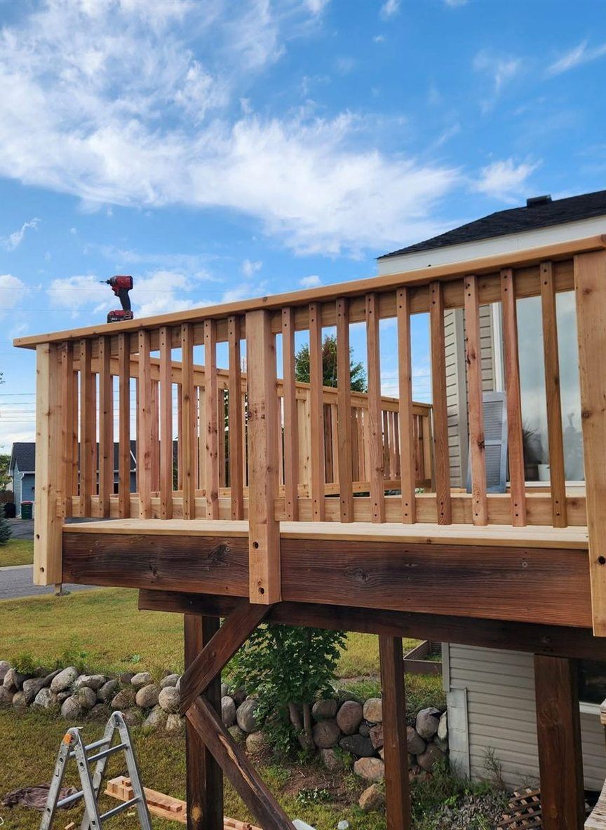 Cedar railing on a second story deck, by New West Co