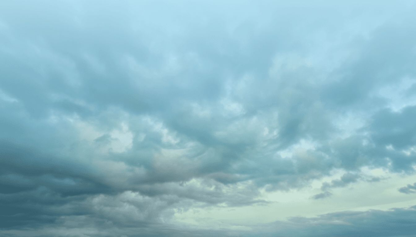 Cloudy sky with grey-blue overcast and soft light.