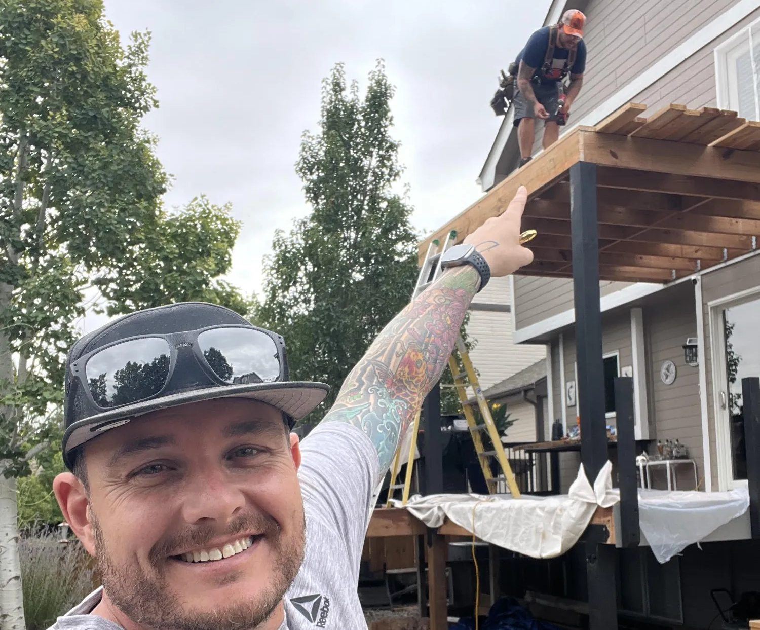 Brothers Jason Maier and Travis Hansen on a deck and pergola build