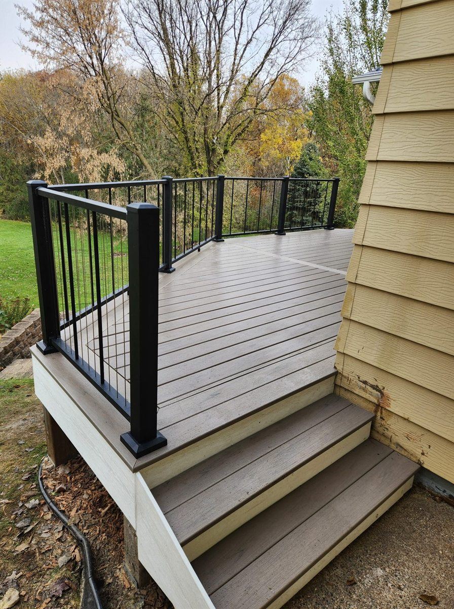 Composite deck stairs and railing, by New West Co
