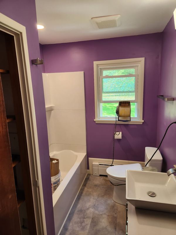 Bathroom with new tub and vanity, by New West Co