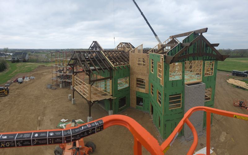 Custom timber frame home going up, seen from the lift