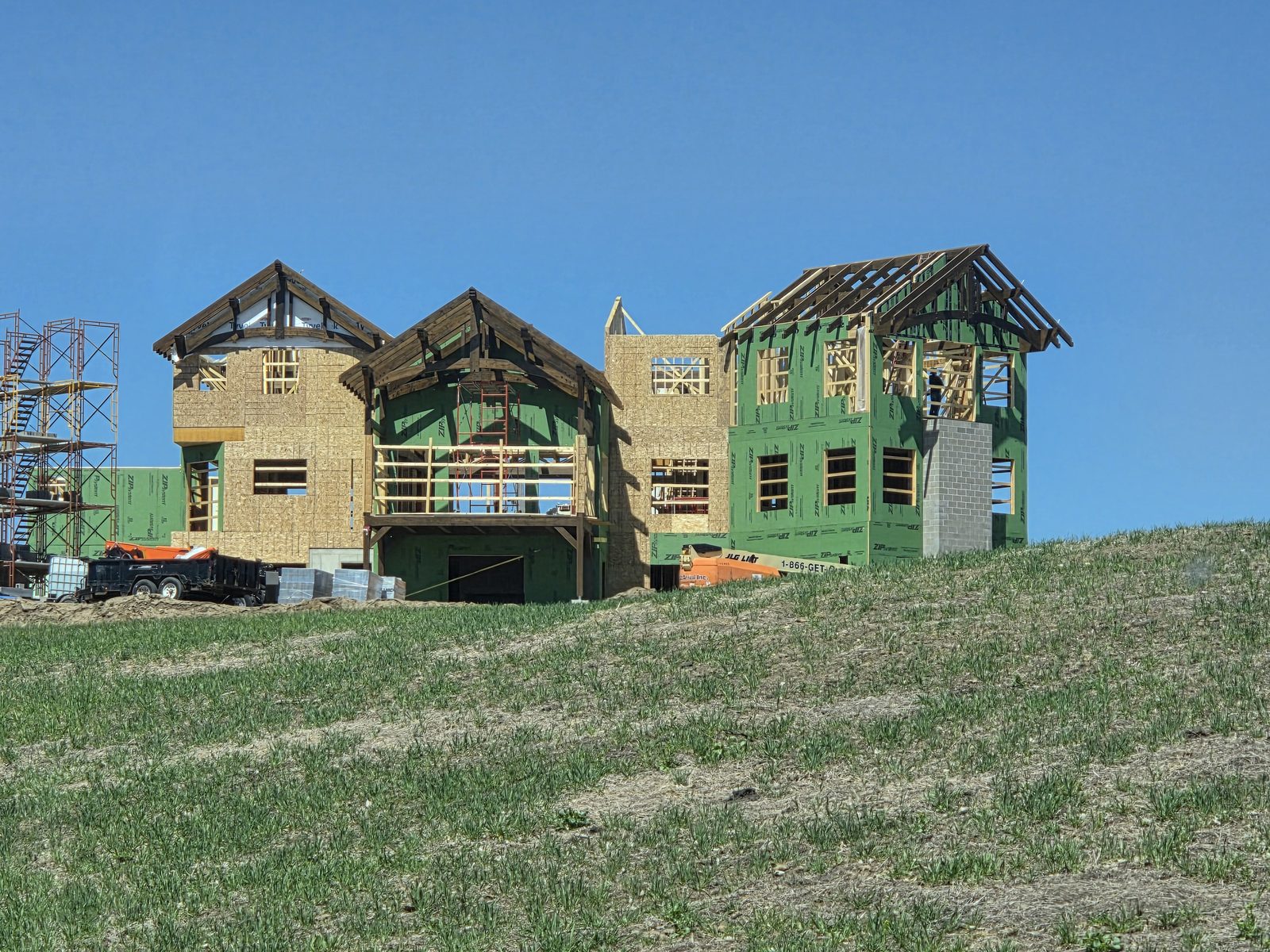 Custom home framing on a hill