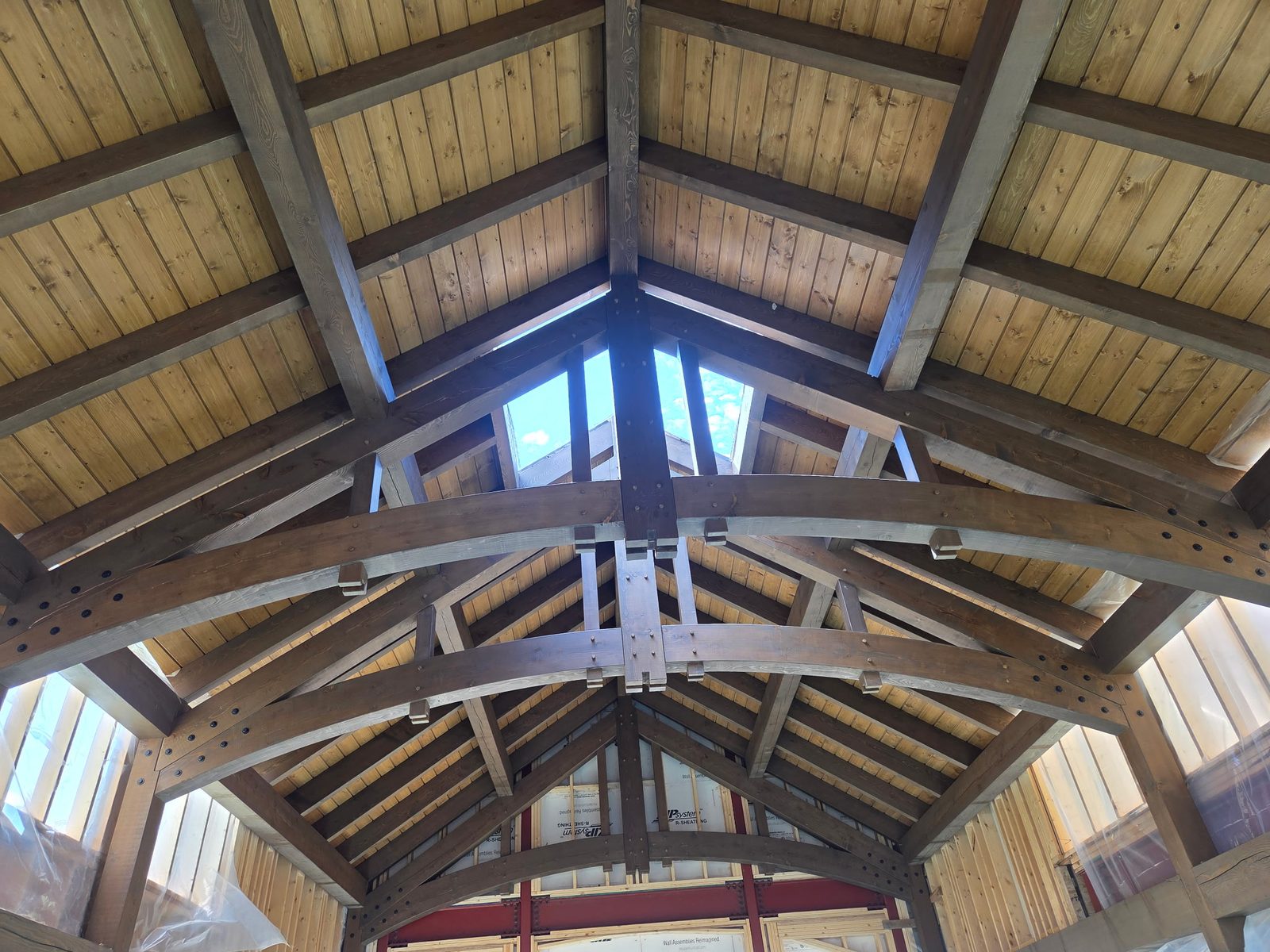 Timber frame ceiling with arched trusses