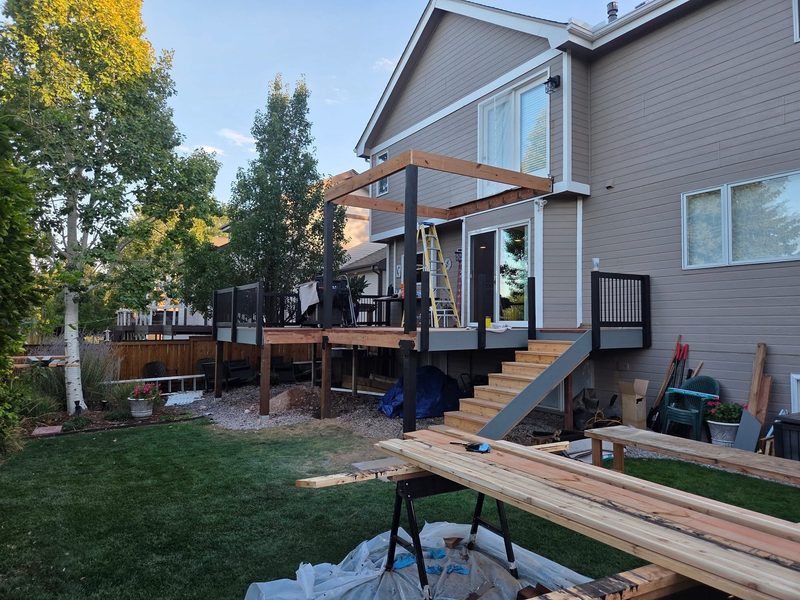 Upper deck and pergola being built, by New West Co