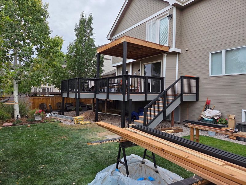 Cedar upper deck with covered roof, by New West Co