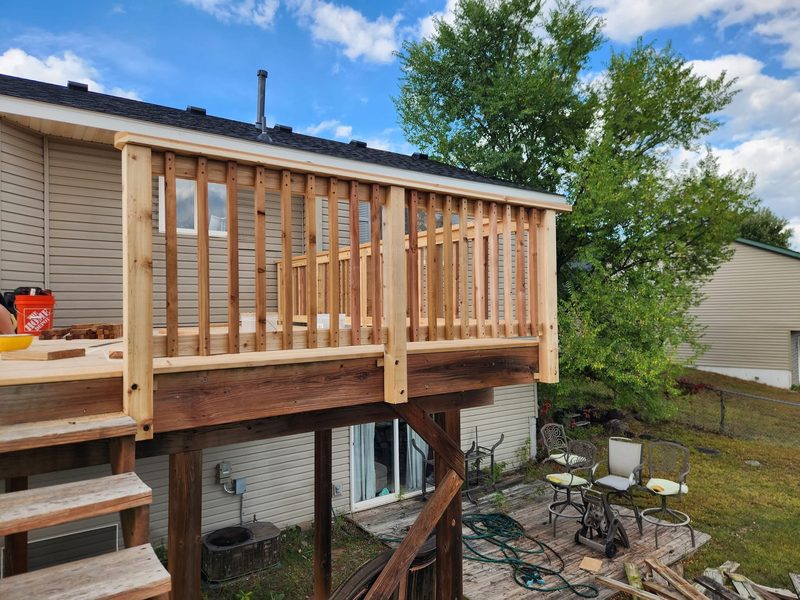 Raised deck with new cedar railing, by New West Co