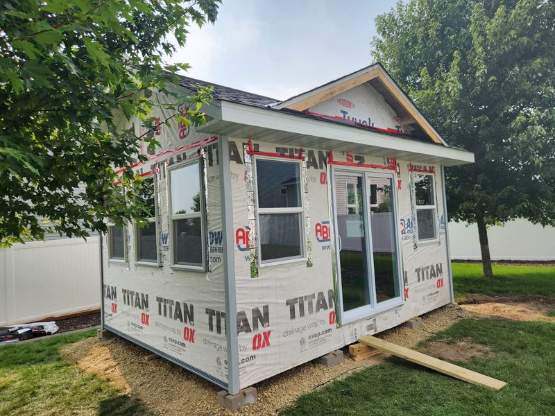 Backyard studio with windows and slider, by New West Co