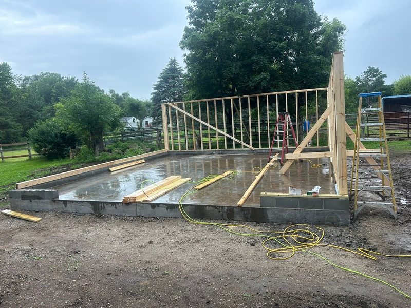 Garage walls going up on the slab, by New West Co